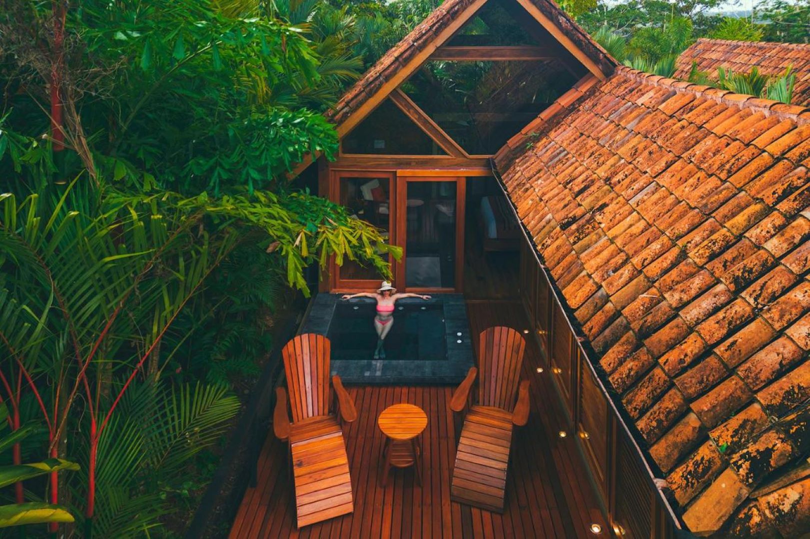 Aerial view of Amor Arenal bungalow with private plunge pool and rainforest surroundings