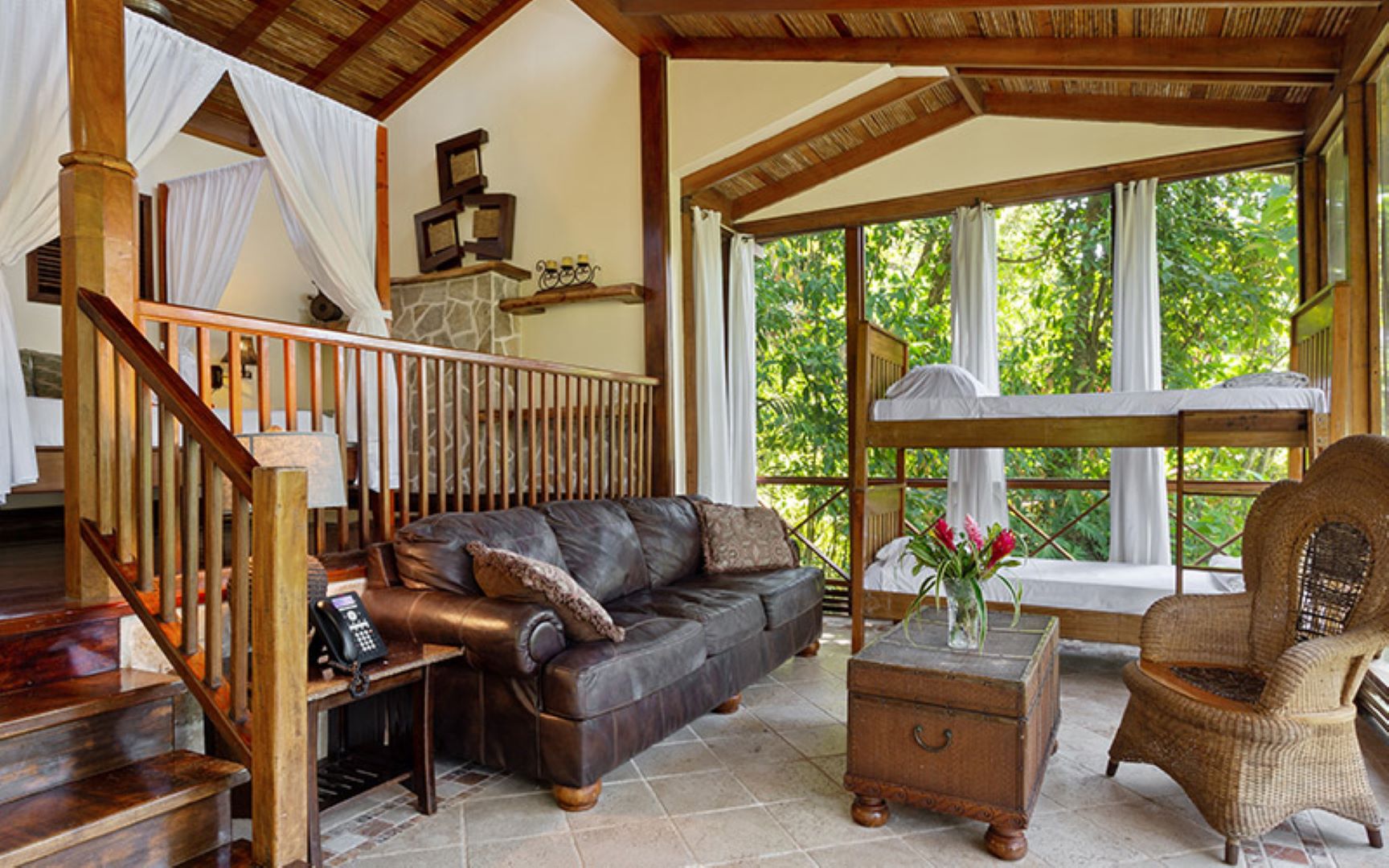 Interior of a luxury treehouse room at Caves Branch Jungle Lodge in Belize.